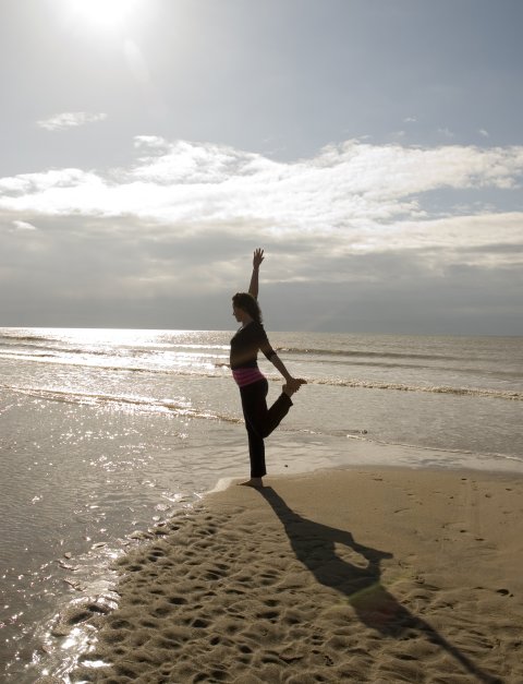 Lisa Powell yoga posture, Camber Sands beach